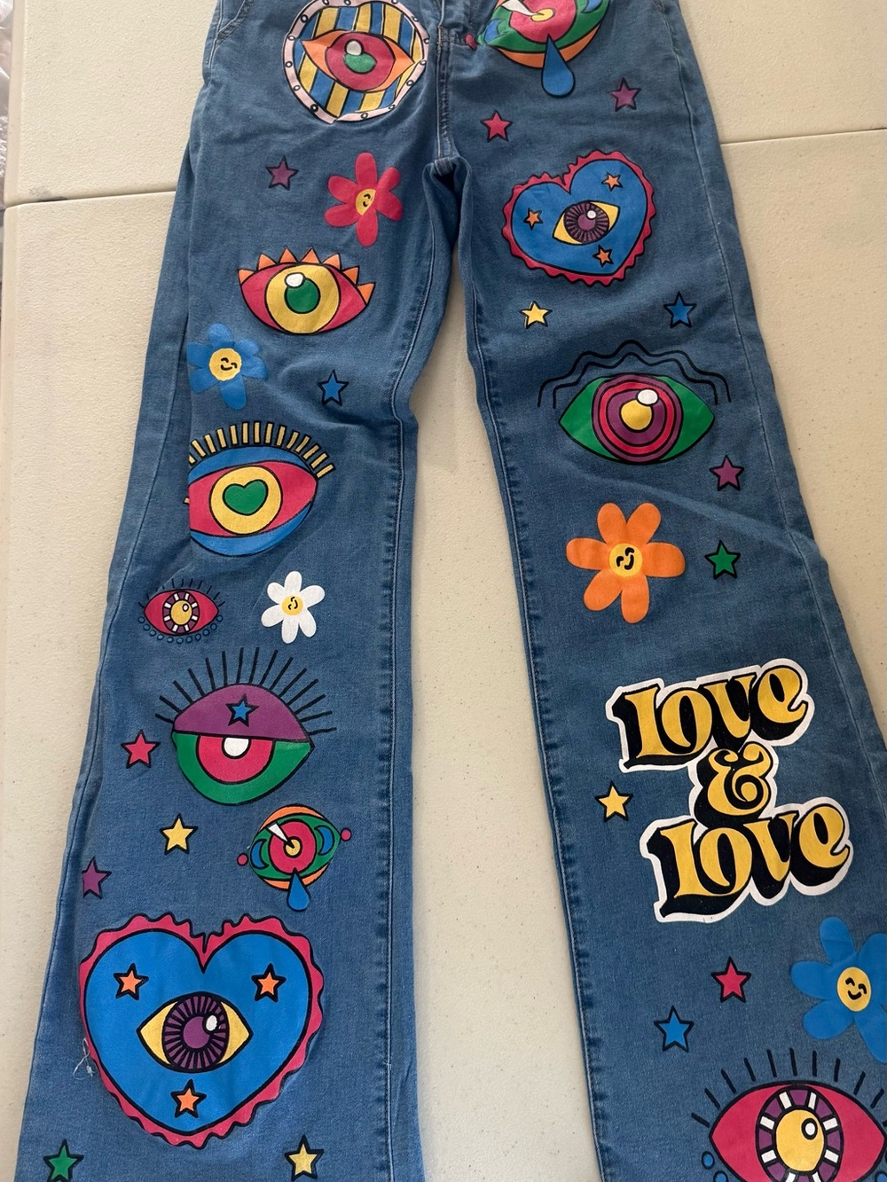 Blue Denim Boot Cut Jeans with Multicolor Graphic Prints